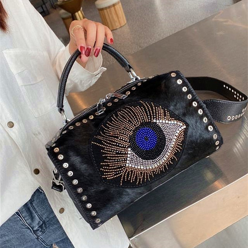 Mati shops evil eye embossed hand painted leather handbag